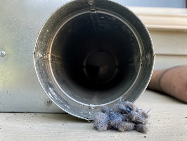 Montville Dryer Vent Cleaning technician using specialized equipment to clear severe dryer vent blockage in Montville